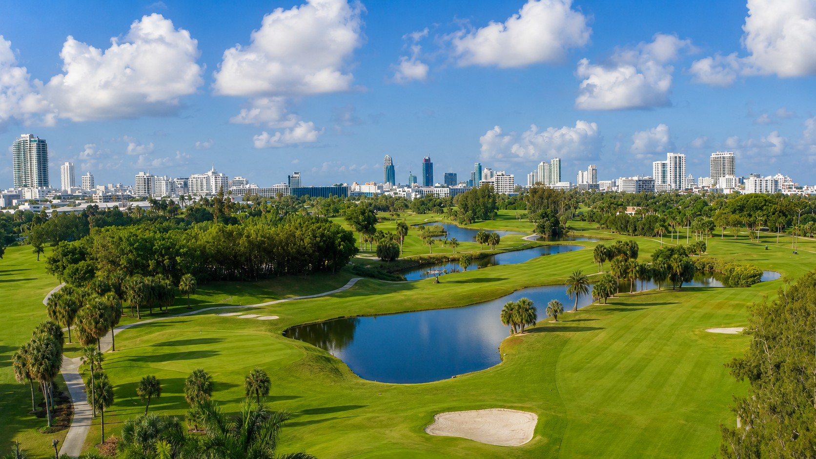 Sunlit Miami golf course overlooking the city